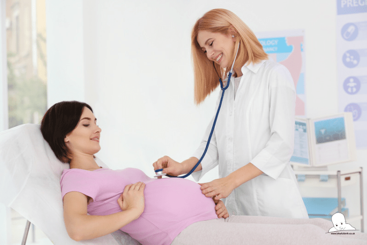 pregnant woman lying in hospital bed